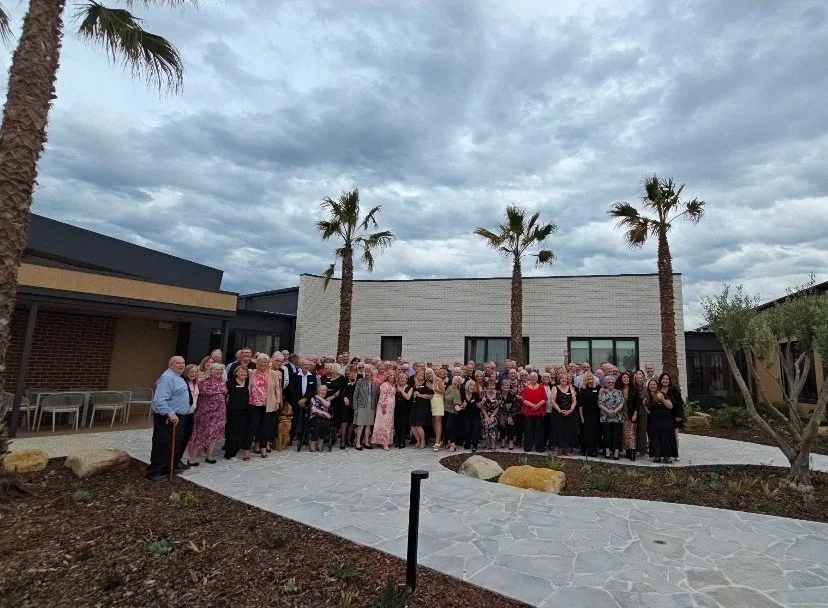 Group photo of people at Halcyon Jardin Clubhouse opening
